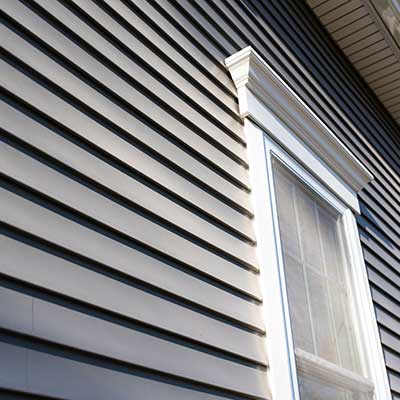 Close up of gray vinyl siding on a home